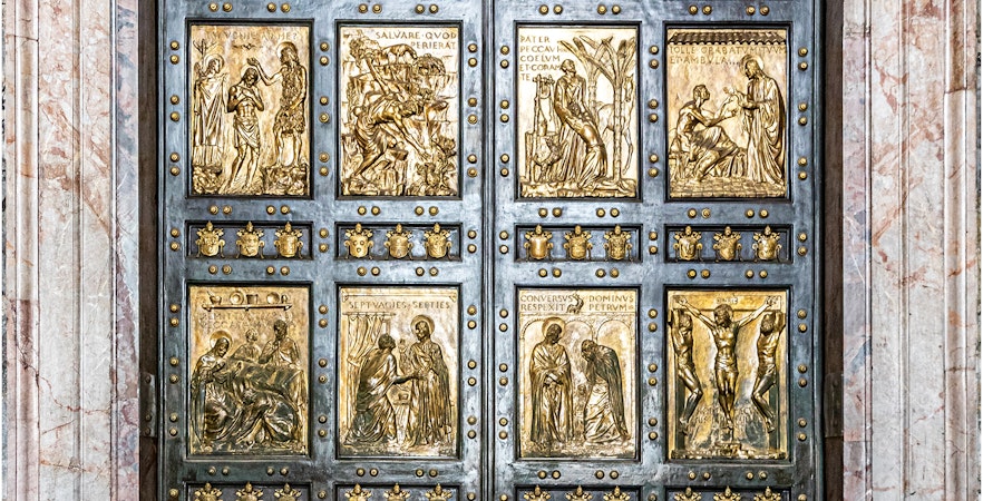 La Porta Santa at St Peter's Basilica, featuring detailed religious carvings.