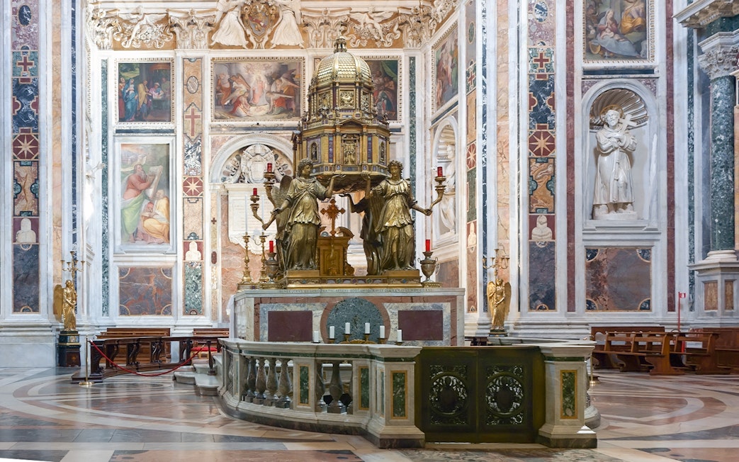 Sistine Chapel of Santa Maria Maggiore interior with ornate altar and frescoes.