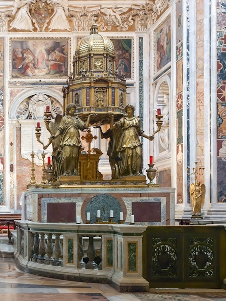 Sistine Chapel of Santa Maria Maggiore interior with ornate altar and frescoes.