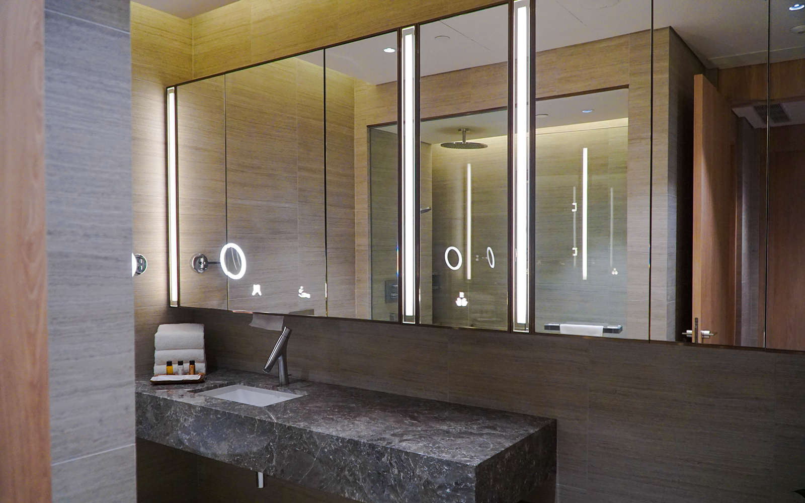 Changi Lounge bathroom with modern sink and mirror, Singapore.