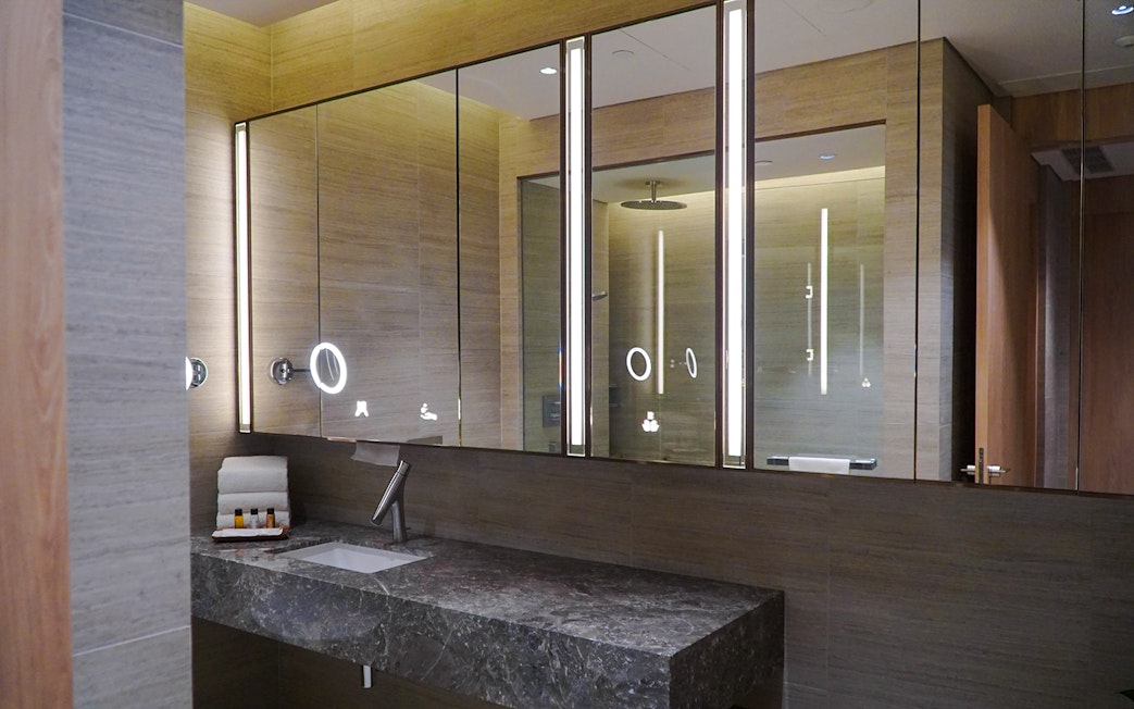Changi Lounge bathroom with modern sink and mirror, Singapore.