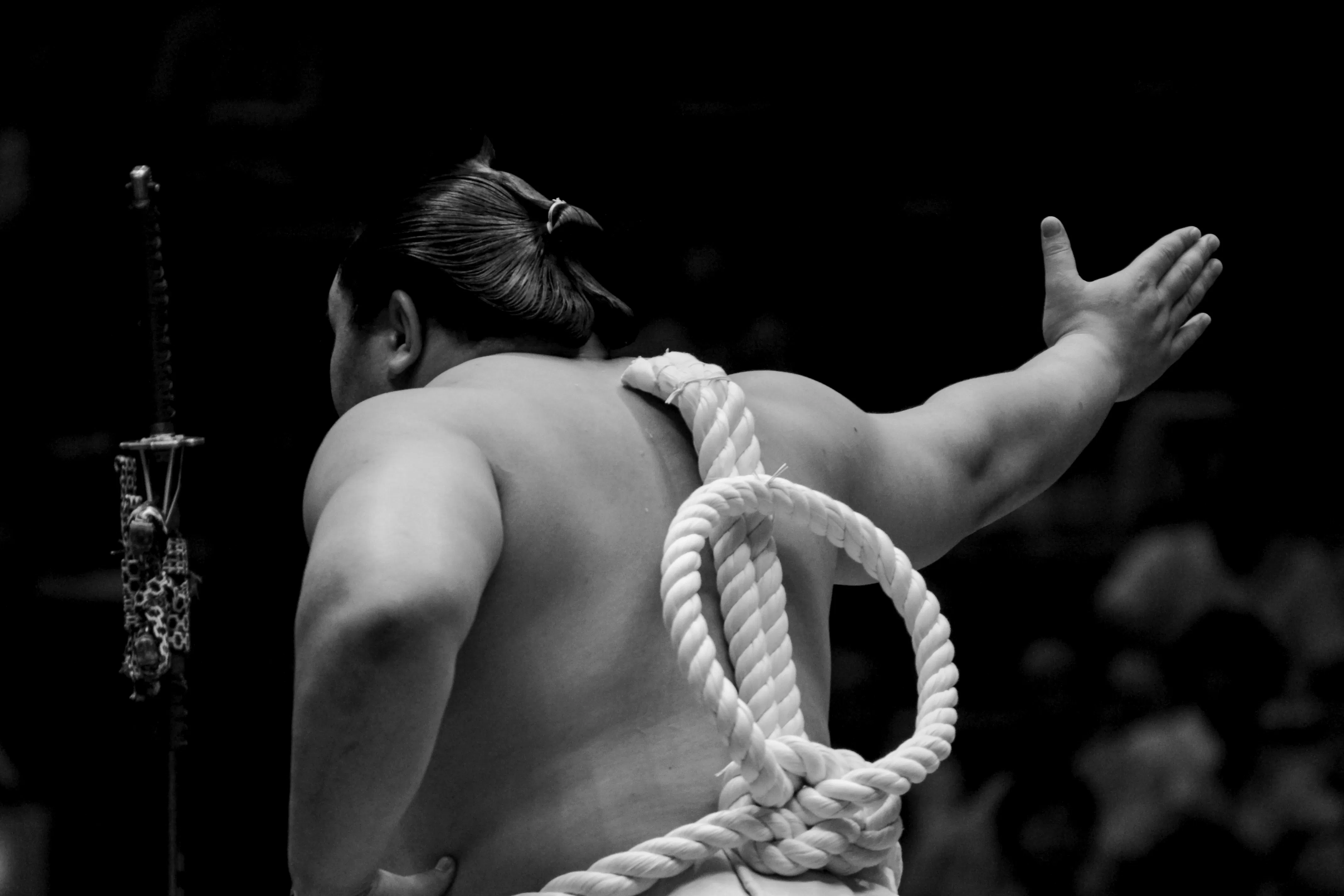 Sumo wrestler preparing for match at Fukuoka Grand Sumo Tournament.