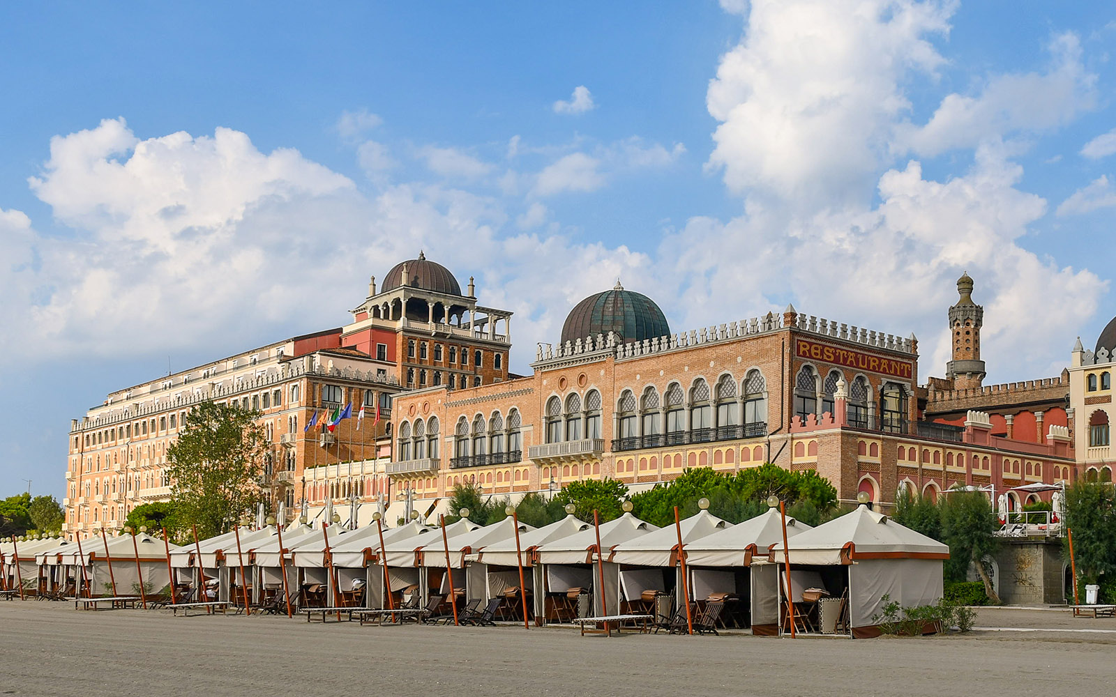 Historic building and beach cabanas at Venice Lido, near the Venice Film Festival location.