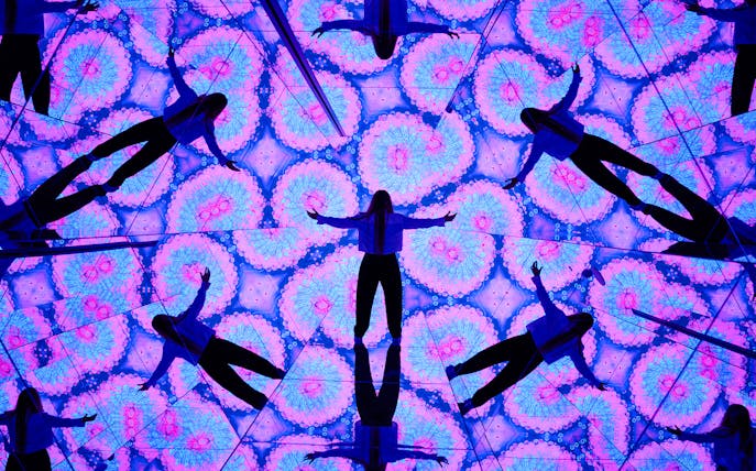 Visitors interacting with mirrored digital displays at House of Hype.