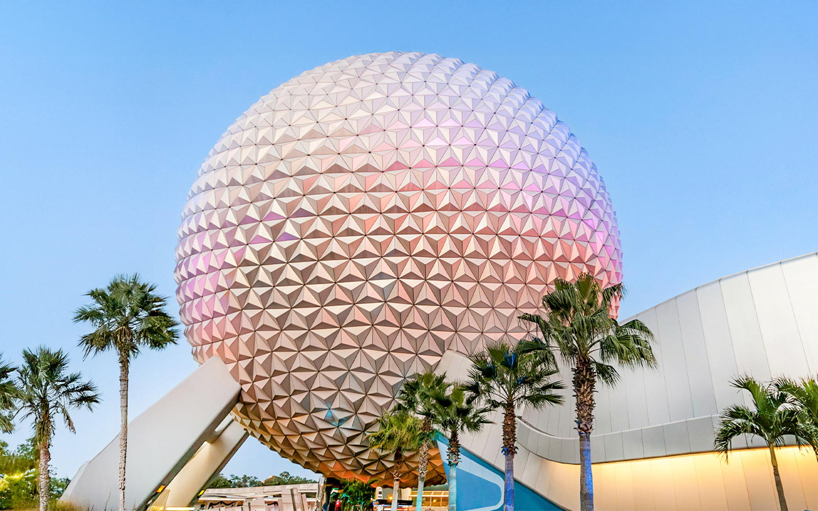 Spaceship Earth at EPCOT Center, Walt Disney Resort Orlando, with palm trees.
