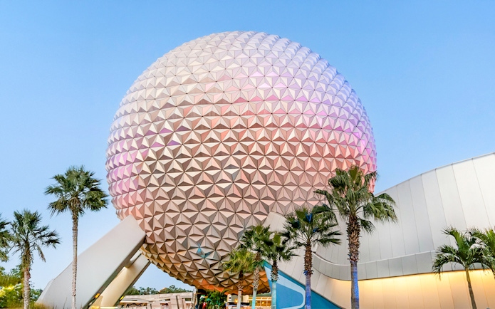 Spaceship Earth at EPCOT Center, Walt Disney Resort Orlando, with palm trees.