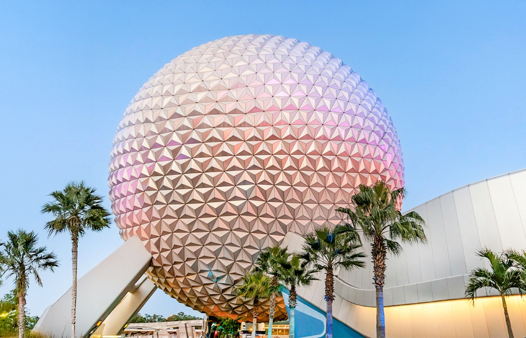 Spaceship Earth at EPCOT Center, Walt Disney Resort Orlando, with palm trees.