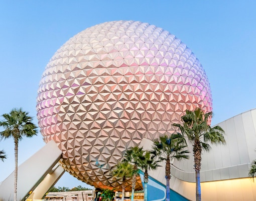 Spaceship Earth at EPCOT Center, Walt Disney Resort Orlando, with palm trees.