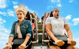 Riders experiencing a roller coaster thrill at Busch Gardens Williamsburg.