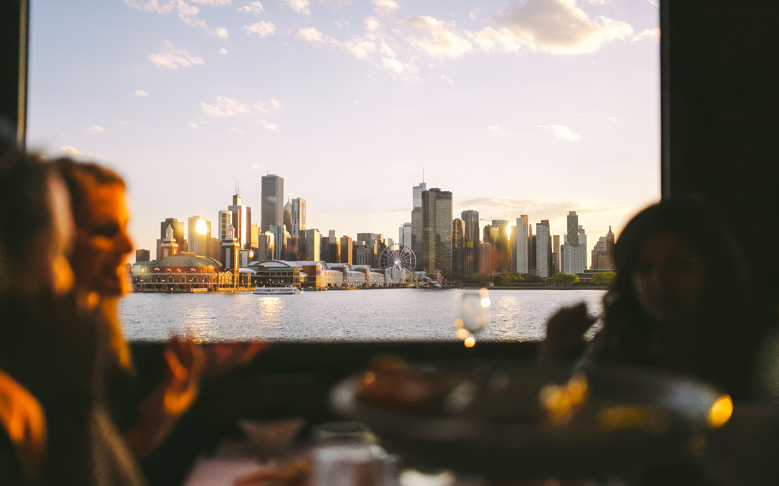 Chicago skyline view from a dinner cruise on Lake Michigan at sunset.