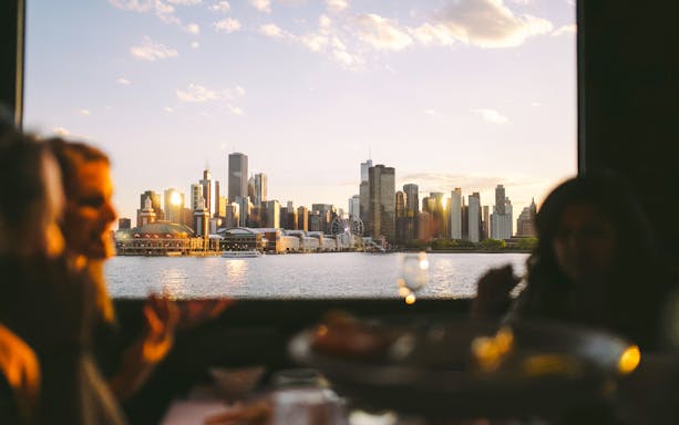 Chicago skyline view from a dinner cruise on Lake Michigan at sunset.