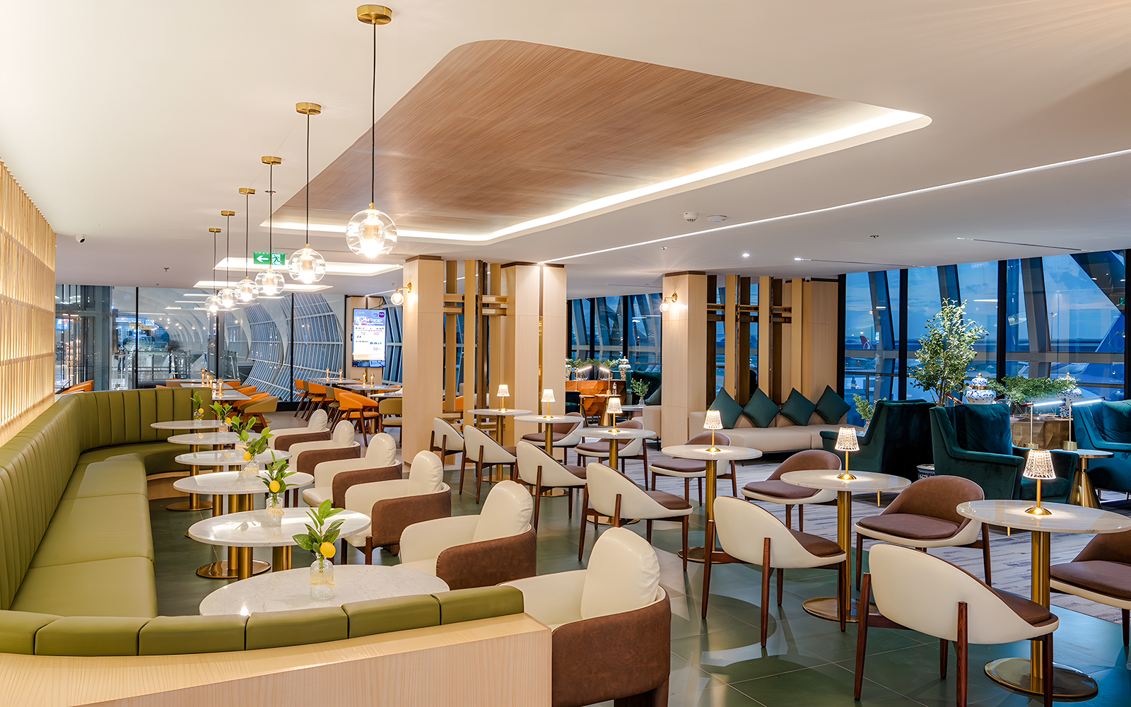 Coral Cosmo Lounge seating area with tables and chairs, Concourse C, Bangkok airport, Thailand.
