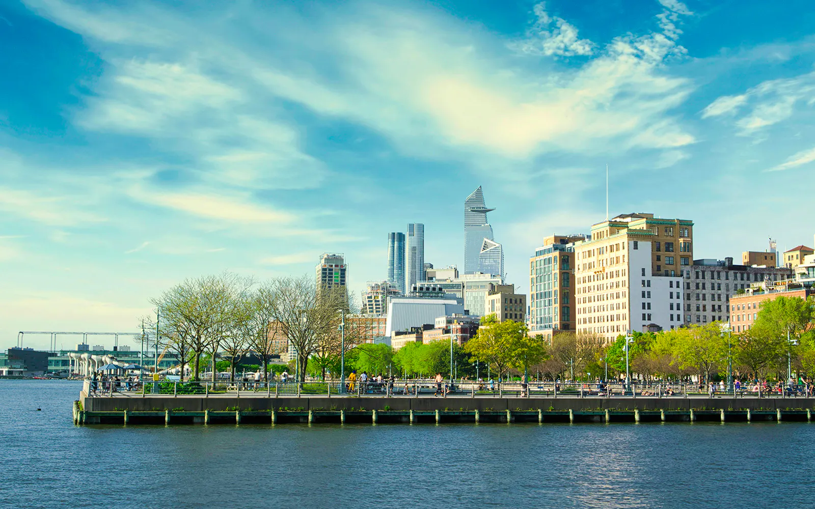 Skyline view from Pier 45 in Manhattan, NYC with Hudson River in foreground.