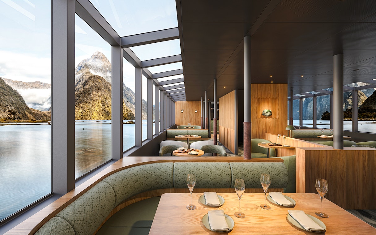 Interior of Sinbad vessel dining area with Milford Sound views.