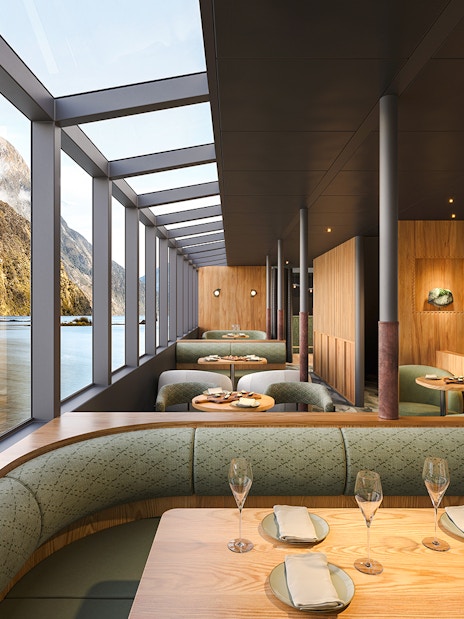 Interior of Sinbad vessel dining area with Milford Sound views.