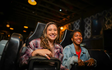 Guests enjoying a ride in Halloween Haunt zones at Dorney Park.