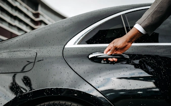 Hand opening car door for Zanzibar private transfer service.