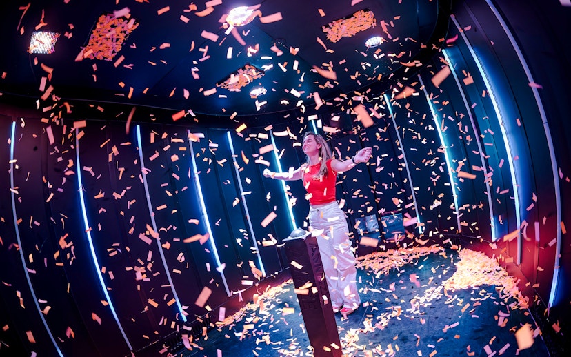 Guest enjoying confetti room at Amaze Amsterdam.