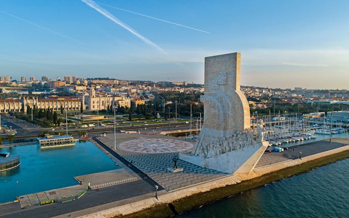 Padrão dos Descobrimentos monument in Lisbon with marina and cityscape in the background.