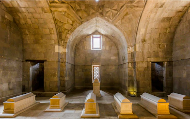 Tombs inside the Palace of Shirvanshahs, Baku, showcasing intricate stone architecture.
