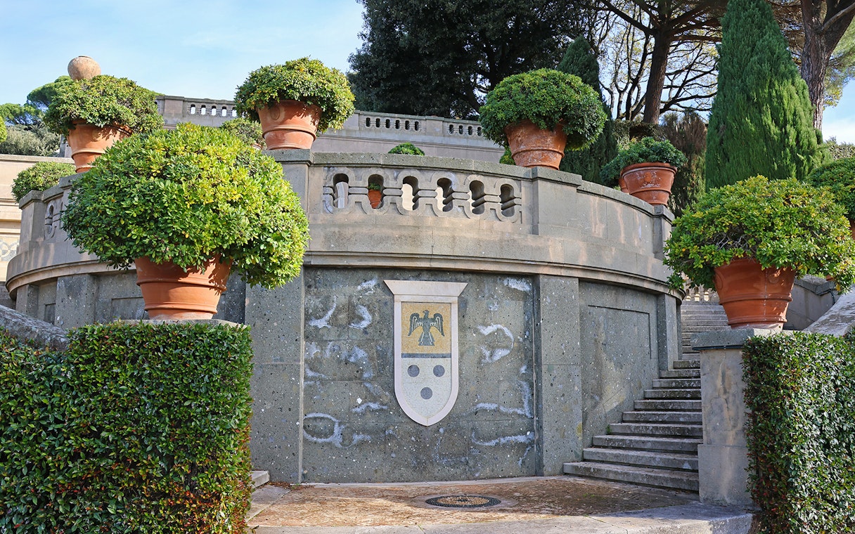 Terracotta pots and greenery in Castel Gandolfo Garden, Italy.