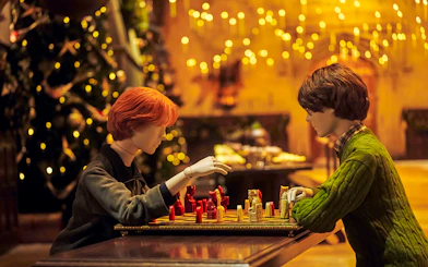 Mannequins playing wizard chess in the Great Hall, Christmas setting, Harry Potter Studio Tour Tokyo.