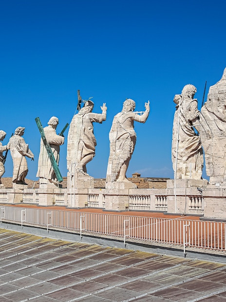 Statues atop St. Peter’s Basilica Dome during guided tour in Vatican City.