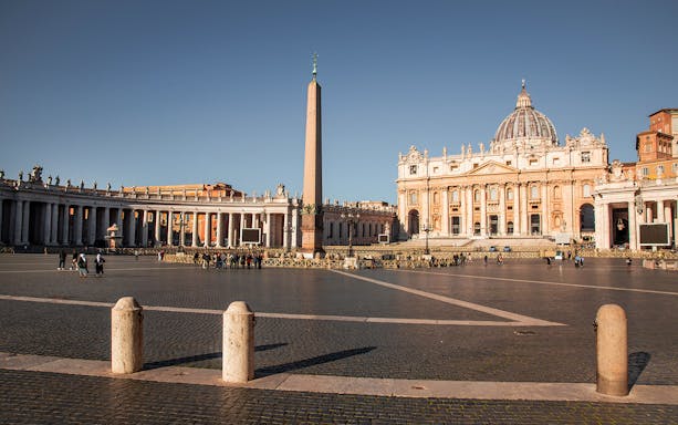 St. Peter's Square with obelisk and basilica, Rome, on a guided minivan tour.
