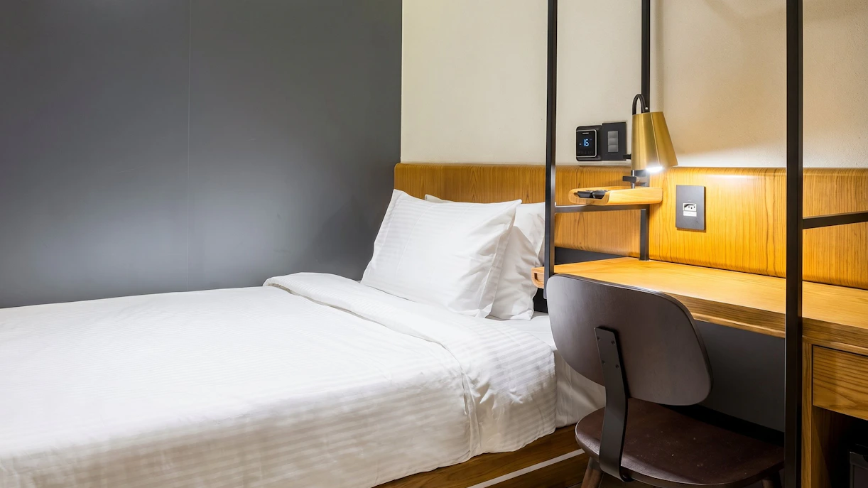 Single bed and desk area at Plaza Premium Lounge, Rio de Janeiro International Airport, Arrivals T2.