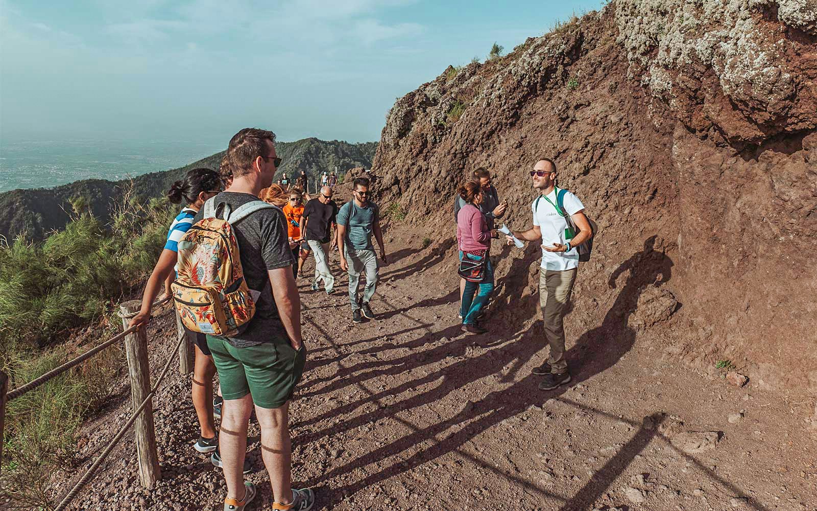 Guide with tourists at Mount Vesuvius