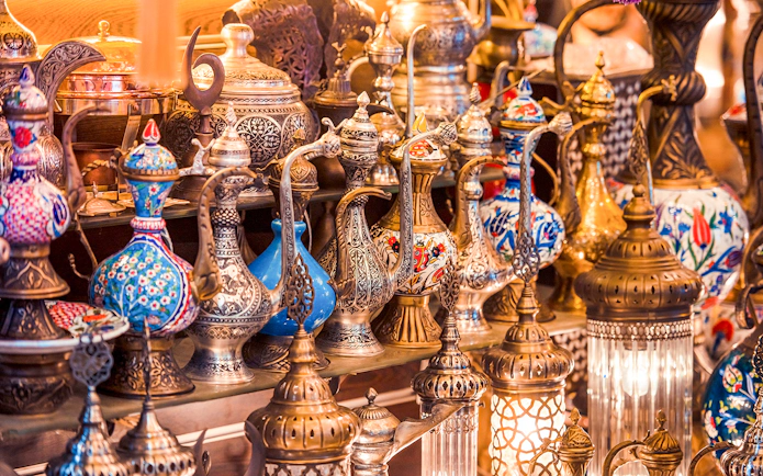Traditional Turkish teapots and lamps displayed in Istanbul market.