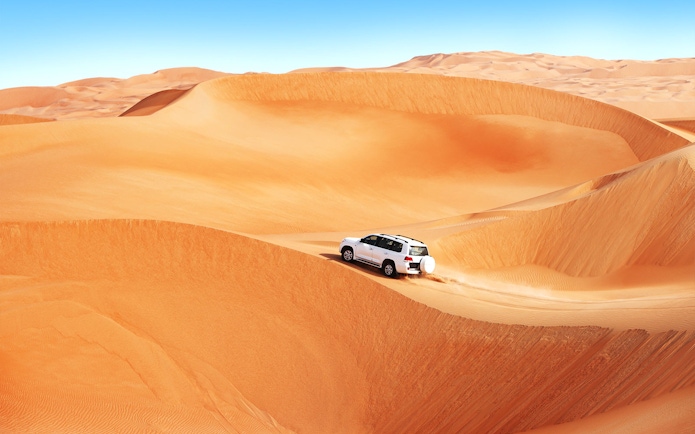 4x4 vehicle dune bashing in the Dubai desert.
