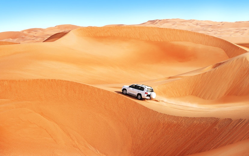 4x4 vehicle dune bashing in the Dubai desert.