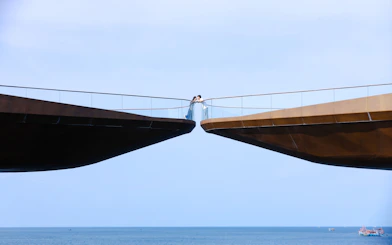 Kiss Bridge over ocean in Phu Quoc during sunset tour.