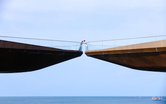 Kiss Bridge over ocean in Phu Quoc during sunset tour.