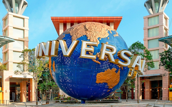 Universal Studios Singapore globe sculpture at entrance.