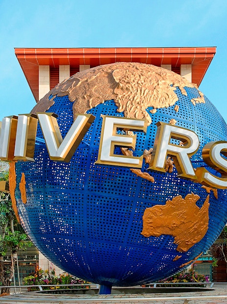 Universal Studios Singapore globe sculpture at entrance.