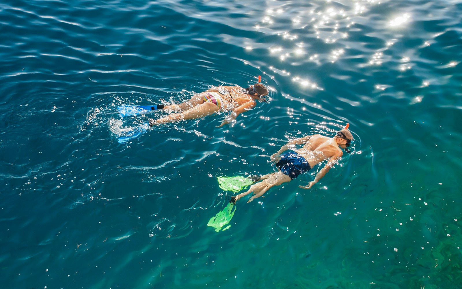 Snorkelers exploring clear waters during a guided dinghy tour to Tavolara Island.