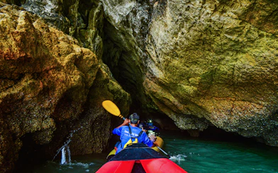 Kayaking through cave at Phang Nga Bay, Thailand.
