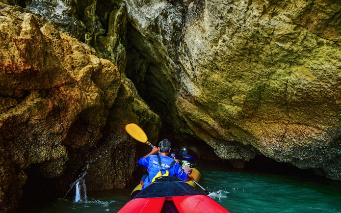Kayaking through cave at Phang Nga Bay, Thailand.