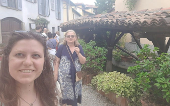 Visitors exploring a quaint street in Milan's Navigli district during a self-guided city game.