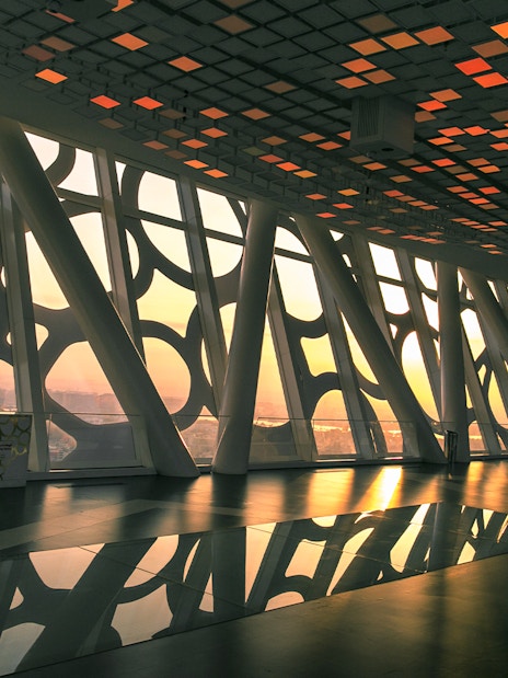 Dubai Frame interior with geometric patterns and city view at sunset.