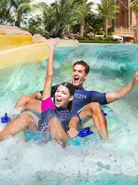 Tourists enjoying water slide at Aquaventure Waterpark, Dubai.