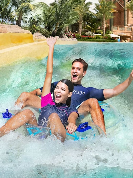Tourists enjoying water slide at Aquaventure Waterpark, Dubai.