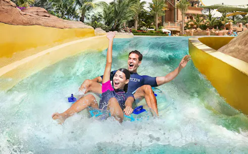 Tourists enjoying water slide at Aquaventure Waterpark, Dubai.
