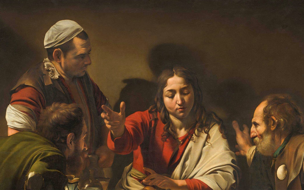 Four men engaged in conversation at a table, depicted in "Supper at Emmaus" by Michelangelo.