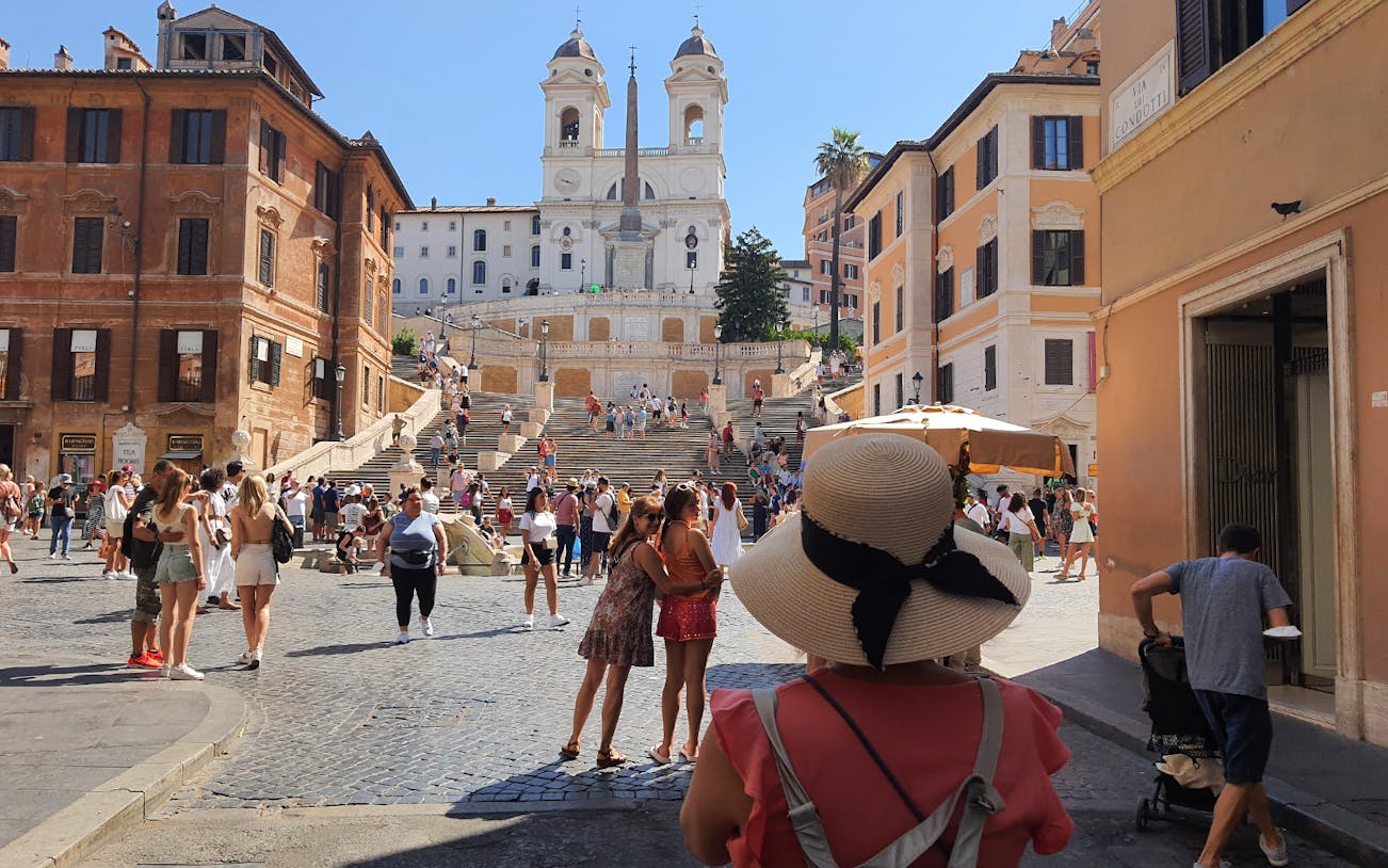 Tourists at the Spanish Steps in Rome during a guided fashion tour.