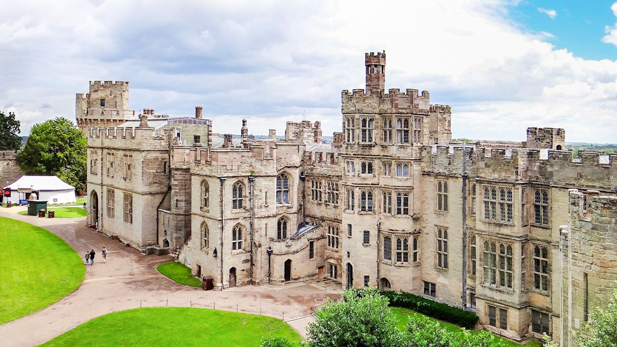 Warwick Castle medieval fortress with lush gardens in Warwick, England.
