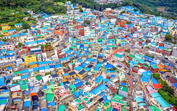 Colorful hillside houses in Gamcheon Culture Village, Busan, seen from above.