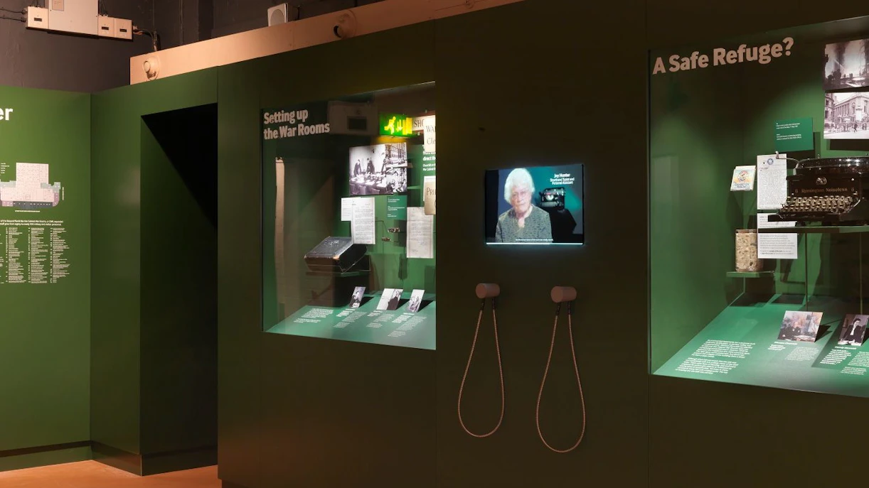Churchill War Rooms Museum exhibit with historical displays and interactive screens.